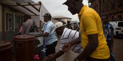 On 19 September, social mobilizers wash their hands with chlorine before handling supplies, in Freetown, the capital.
From 1921 September in Sierra Leone, a public information campaign aimed to reach every household countrywide with life-saving messages on Ebola virus disease (EVD). UNICEF provided technical and financial support, including information materials, for the Government-led campaign, called the Ose to Ose Ebola Tok initiative, which means house-to-house talk in the local Sierra Leonean language. During the campaign, over 28,500 trained social mobilizers, youths and volunteers went door-to-door to reach 1.5 million households and provide residents with information on protecting themselves against EVD and preventing its spread. UNICEF estimates that 8.5 million children and young people under the age of 20 live in areas affected by EVD in Guinea, Liberia and Sierra Leone, countries where disease transmission is widespread and intense. Of these, 2.5 million are under the age of 5. Nigeria and Senegal are also affected, having seen an initial case or cases, or experienced localized transmission. The current EVD outbreak in West Africa is the worst in history. UNICEF/UNI171266/Bindra