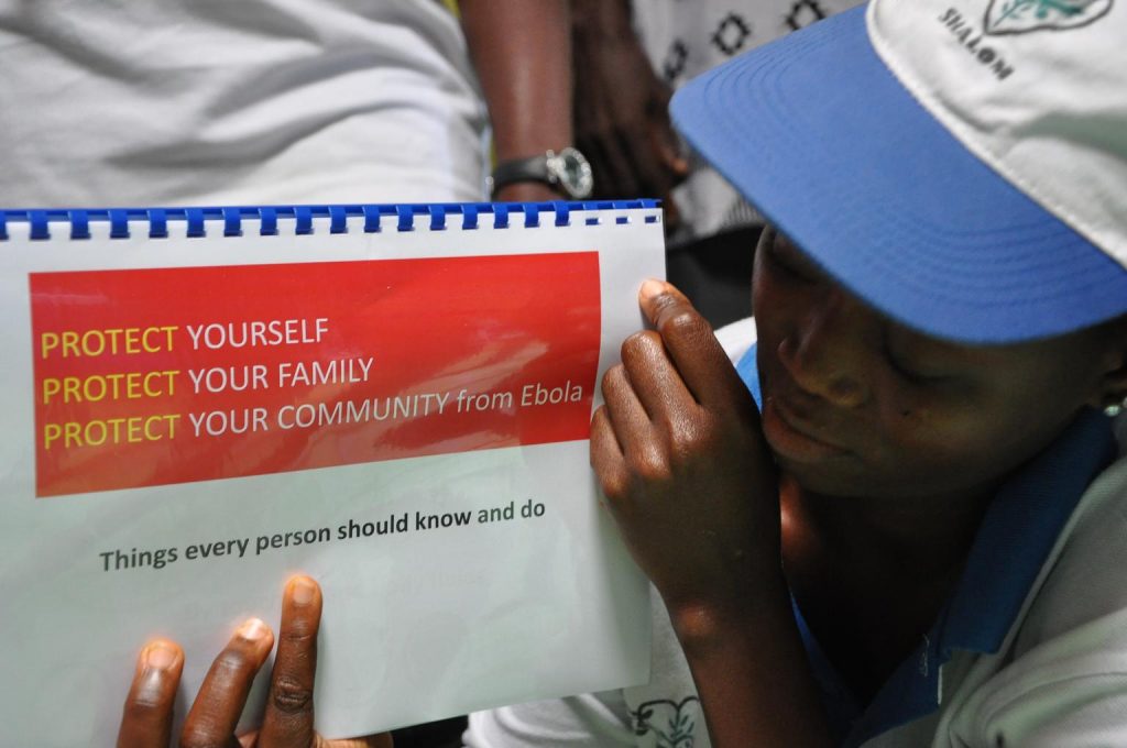 On 27 August, UNICEF conducted a Training of Trainers or ToT on Ebola outreach for over 50 adolescent girls, boys and community leaders in West Point and New Kru Town - two communities in Monsterrado County that have experienced high rates of Ebola infections. UNICEFs primary targets during these ToTs were members of agency-supported girls clubs. Since the ToTs, a total of 300 girls have been trained and deployed by UNICEFs implementing partners to conduct outreach in the two communities. All 300 have been equipped with flipbooks and posters to support their door-to-door efforts. UNICEF is proud of the role these young leaders are playing in the fight against Ebola. In this photo, a member of the New Kru Town girls club shows off her recently acquired flipbook.
Nearly six months since the start of the first Ebola outbreak, over 3,500 suspected, probable and confirmed Ebola cases have been reported in all of Liberias 15 counties, including in the capital city of Monrovia. Alarmingly, this figure reflects an 11-fold increase in cases in the last two months alone. Sixty per cent of the probable and confirmed cases have resulted in death and, as of 26 September, 183 health workers had been affected by the disease and 92 of them had died. Raising awareness and encouraging key behaviour changes are two major tactics in the battle against this deadly disease, but they are not the only tactics. Ensuring Liberians are equipped with the hygienic materials they need to protect themselves against the virus; that Ebola Treatment Units (ETUs) and general health facilities are stocked with life-saving medical, hygienic and sanitation supplies; and that people affected by Ebola, including children, receive the support they need to reintegrate into society and lead productive lives, are all equally important interventions. UNICEF Liberias Health, Water, Sanitation and Hygiene (WASH), Supply and Child Protection experts are all heavily engaged in these UNICEF/UNI171709/Scott