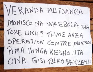 A sign posted in Beni on November 25 in response to the UN and Ebola responders. Translation: MONUSCO and Ebola staff should leave this place. We have started an operation against MONUSCO, tomorrow you will see [the bandits we are]. Reproduced with permission.